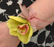 Green Silk Orchid & Burgundy Bow Pearl Band Wrist Corsage